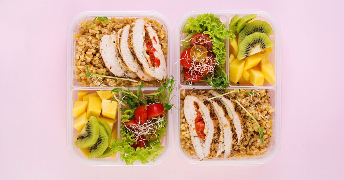 lunch-box-chicken-bulgur-microgreens-tomato-fruit-healthy-fitness-food-take-away-lunchbox-top-view2-min (1)